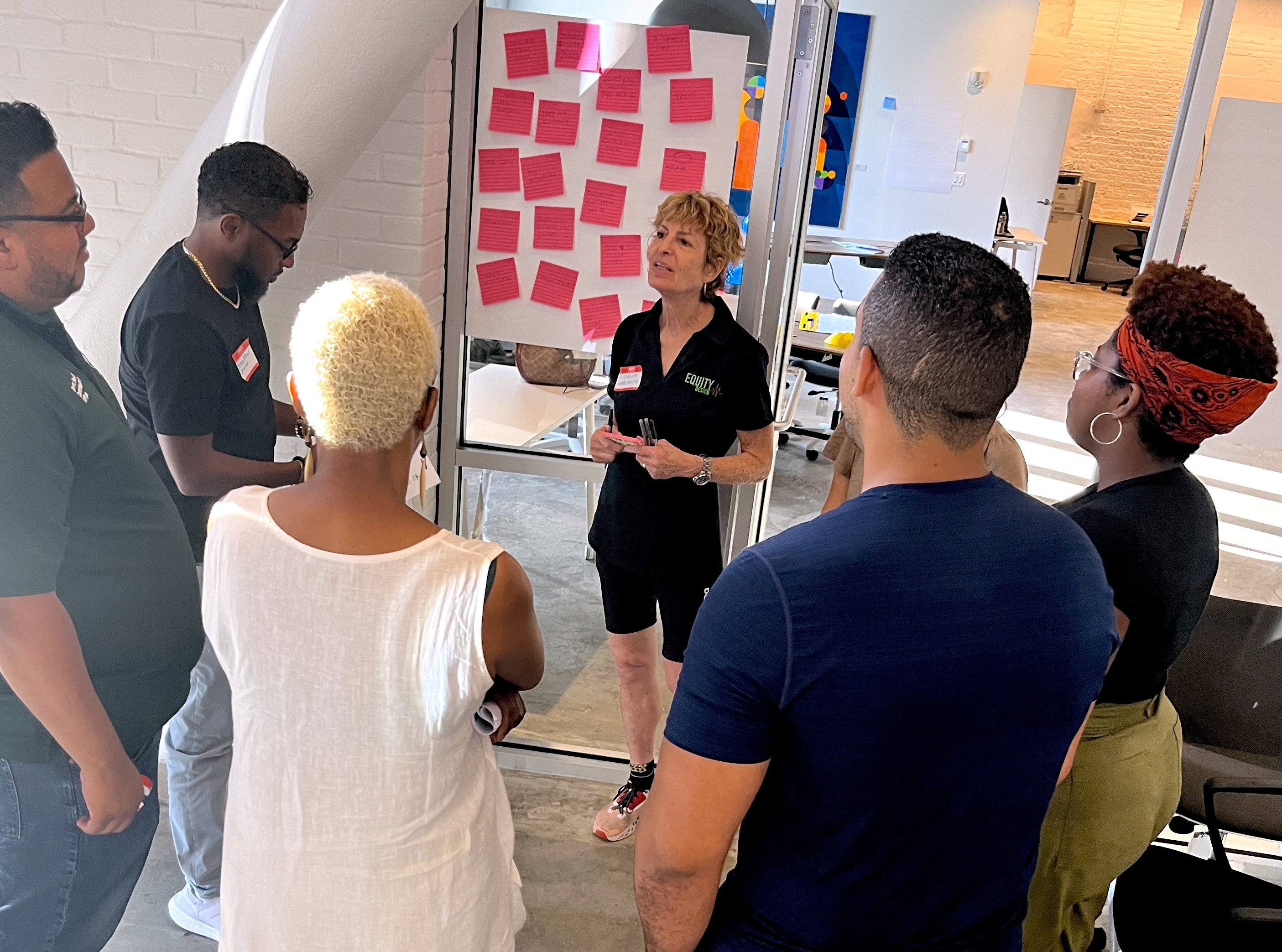 People doing agility training with ladder drills and orange cones