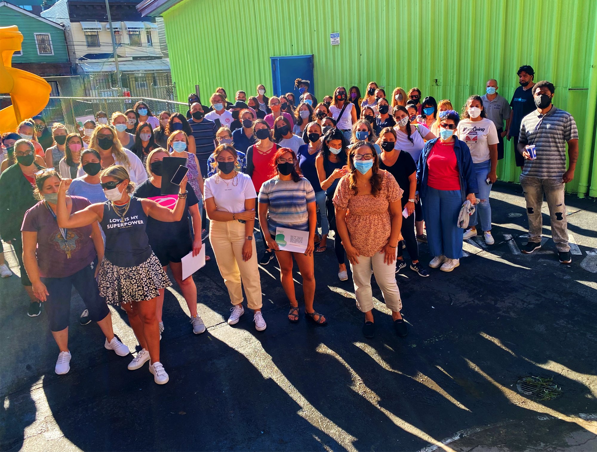 Community members gathered outside a building for an event