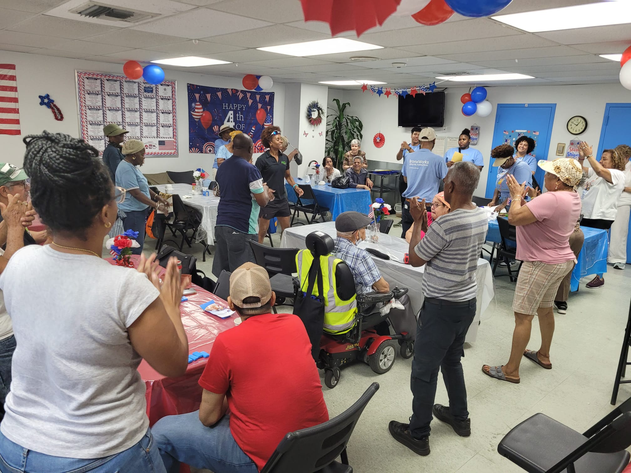 Community members gathered in a decorated room for a celebration event