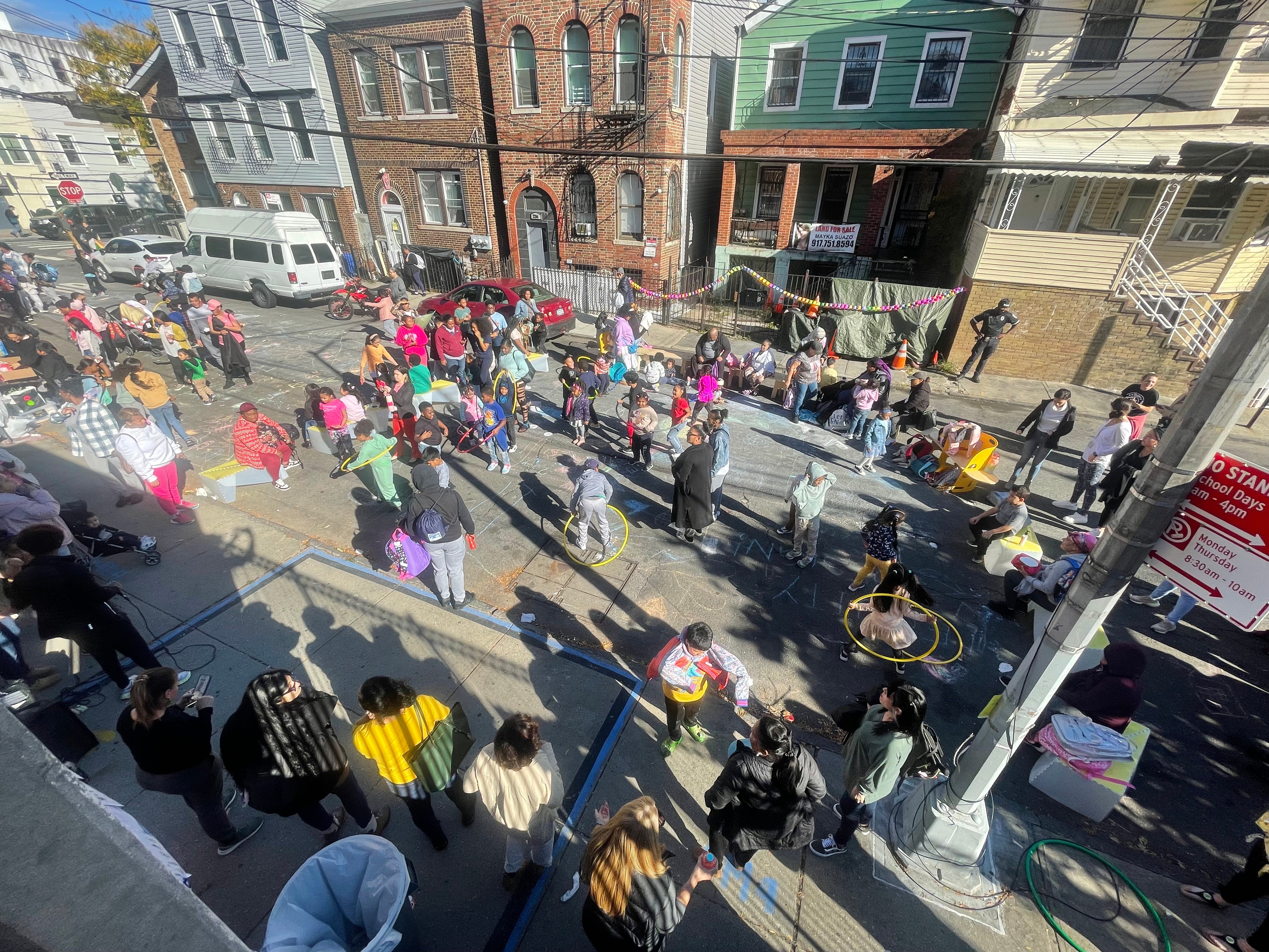 Community gathering with people participating in street activities