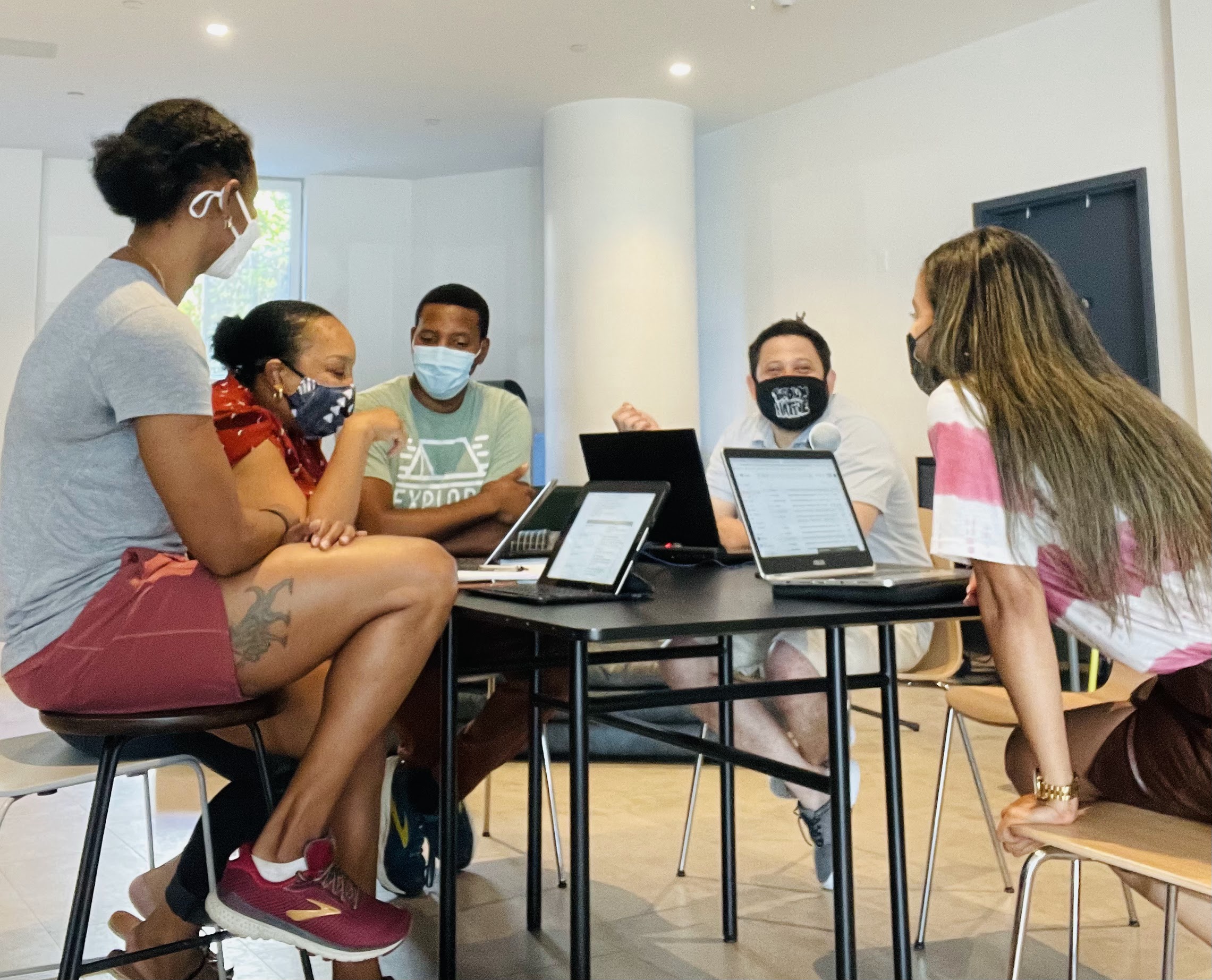Community members in a planning meeting discussing program data